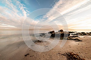 Galicia beach with rocks at sunset