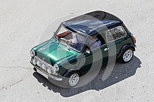 High angle view of a Morris Mini Cooper classic car driving on a road