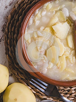Galician broth with potatoes in vertical composition