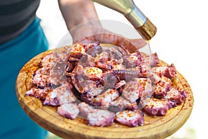 Galician style cooked octopus with paprika and olive oil. photo