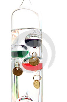 Galileo thermometer with glass balls isolated on white showing t