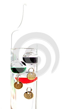 Galileo thermometer with glass balls isolated on white showing t