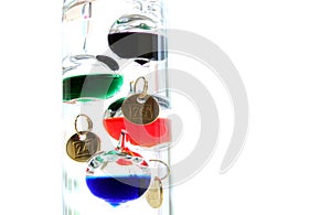 Galileo thermometer with glass balls isolated on white showing t