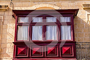 Gallarija, closed balconies, typical of Malta, red in colour