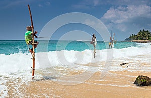 Galle, SRI LANKA. The local fishermen are fishing in unique style.