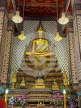 Gallery with old vessels of the seated Buddha in the Buddhist temple Wat Arun. Bangkok, Thailand