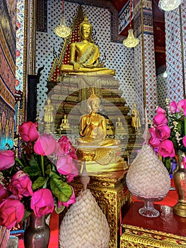 Gallery with old vessels of the seated Buddha in the Buddhist temple Wat Arun. Bangkok, Thailand