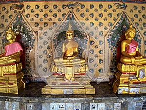 Gallery with old vessels of the seated Buddha in the Buddhist temple Wat Arun. Bangkok, Thailand