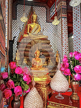 Gallery with old vessels of the seated Buddha in the Buddhist temple Wat Arun. Bangkok, Thailand