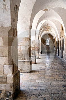 Gallery with pillars and arches in ancient building