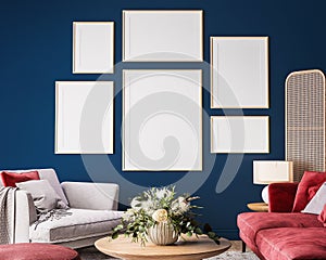 Gallery wall in living room interior mock-up with red sofa, wooden table and rattan home decoration in dark blue background