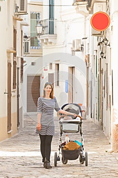 Gallipoli, Apulia - A woman out for a walk with her baby in the