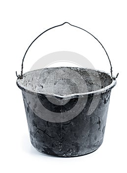 5 gallon black plastic bucket used for mixing concrete isolated on white
