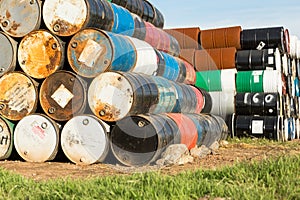 55 Gallon Drums Stacked on Each Other in a Storage Facility photo