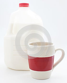 Gallon of milk and a cup