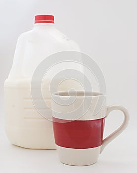 Gallon of milk and a cup