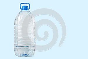 Gallon of water in a big bottle,water delivery, clean drinking water on a blue background, copy space