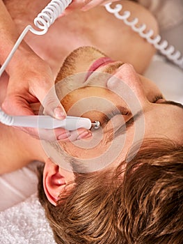 Galvanic stimulation facial male face treatment