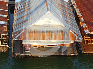 Galvanized iron gable, house boat in the river