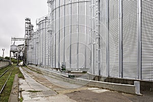 Galvanized steel silos for grain storage. Railway access roads for loading railway cars with grain
