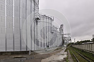 Galvanized steel silos for grain storage. Railway access roads for loading railway cars with grain