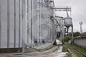 Galvanized steel silos for grain storage. Railway access roads for loading railway cars with grain