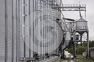 Galvanized steel silos for grain storage. Railway access roads for loading railway cars with grain