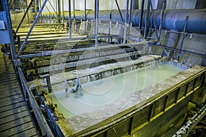 Galvanizing in etching acid containers in galvanic workshop photo