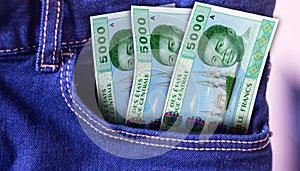 Gambia 100 Dalasi Banknotes in Pocket of Jeans