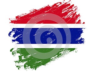 Gambia flag painted on a grunge brush stroke white background