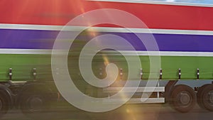 Gambia flag shown on the side of a large truck