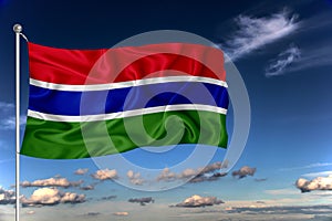 Gambia national flag waving in the wind against deep blue sky.  International relations concept