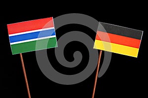 Gambian flag with German flag isolated on black