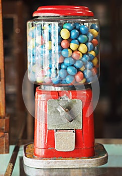 Gamble eggs in vintage gumball machine at grocery store