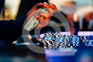 A gambler eagerly awaits his fortune at roulette