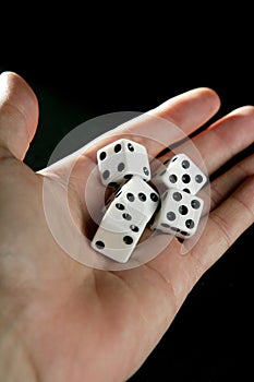 Gambler five dices in human hand