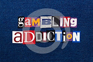 GAMBLING ADDICTION word text collage, multi colored fabric on blue denim, gambling urge addiction concept