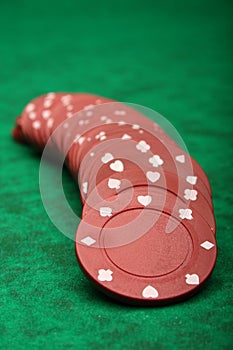 Gambling chips over green felt