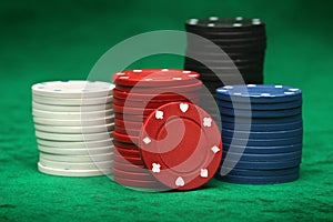 Gambling chips over green felt