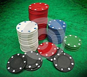 Gambling chips over green felt