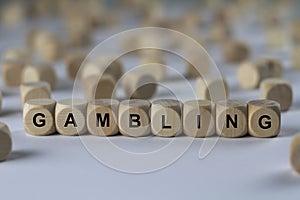 Gambling - cube with letters, sign with wooden cubes