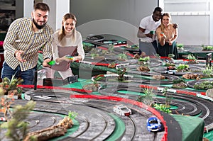 Gambling male and female play in racing track