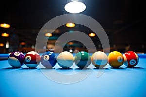 The game of American billiards. Multi-colored billiard balls on gaming table.