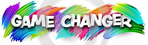 Game changer paper word sign with colorful spectrum paint brush strokes over white