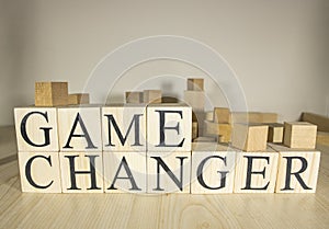 Game changer text on wooden cube blocks. Close up