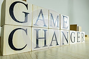 Game changer text on wooden cube blocks. Close up