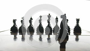 Game of chess, the silhouette figures on a white background.