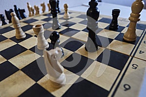 Game of chess, white king in trouble, horse in trouble, checkmate in one move