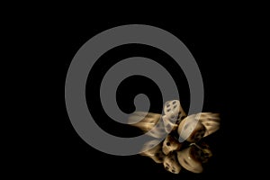 Game cubes on shiny black table with dark reflection