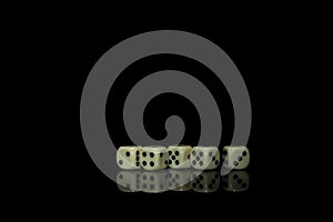 Game cubes on shiny black table with dark reflection